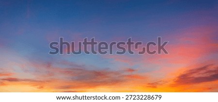 Vibrant Panoramic Sunset Sky with Dramatic Pink and Orange Clouds,A breathtaking panoramic view of a sunset sky featuring a vivid transition from deep blue to brilliant orange and pink hues,