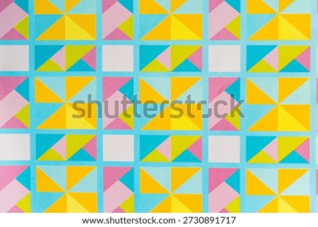 Vibrant Pastel Geometric Quilt Pattern with Colorful Triangles and Squares