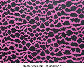 A vibrant pink and black abstract pattern, possibly a textile, featuring an irregular, interlocking grid-like design.