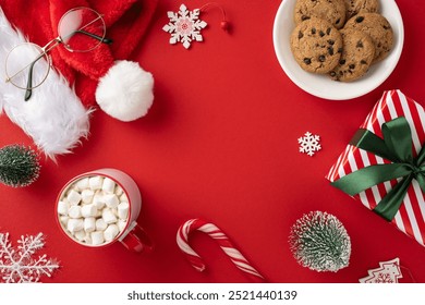 A vibrant red background featuring Christmas treats and decorations, including cookies, marshmallows, and gifts, perfect for holiday celebrations - Powered by Shutterstock