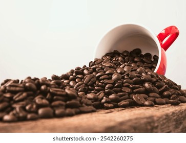 A vibrant red cup spills rich coffee beans onto a rustic wooden surface. This image showcases the allure of coffee culture and its aromatic essence. - Powered by Shutterstock