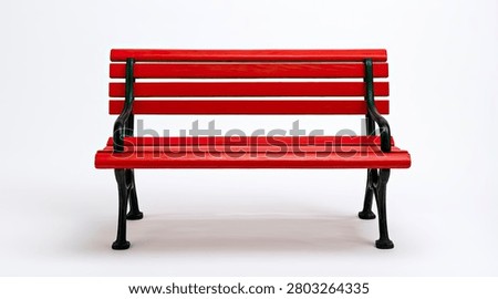 A vibrant red park bench, featuring a slatted seat and backrest, stands on black metal legs against a clean white backdrop.