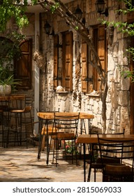 A vibrant  rustic windows Mediterranean charm through vivid shutters and textured stone facades.