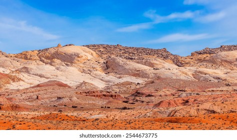 Vibrant sandstone formations in Utah's desert landscape create a stunning contrast against the clear blue sky, showcasing natural beauty and geological wonder. - Powered by Shutterstock