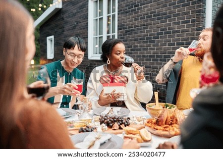 Similar – Freunde essen Kuchen und haben Spaß auf der Party.