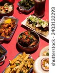 Vibrant Selection of Traditional and Modern Tapas Dishes on a Bright Pink Background - Stylishly Staged Photography Ideal for Trendy Modern Eateries