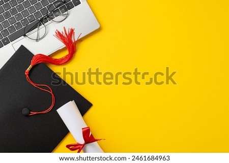 A vibrant setup featuring a graduation cap with a red tassel, diploma, glasses, and a laptop on a yellow background symbolizing online education and graduation achievements