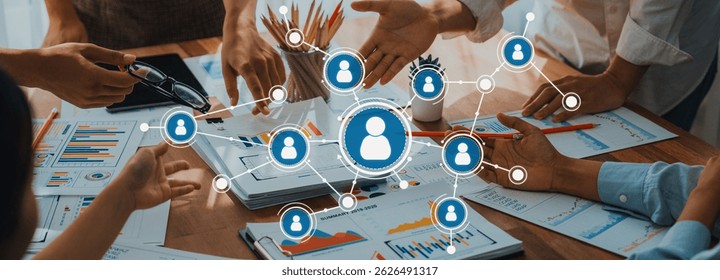A vibrant snapshot of hands collaborating over charts and graphs in a networking environment, emphasizing teamwork, strategy, and innovative discussions among professionals. Amity
