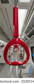 Vibrant straphanger in a subway train