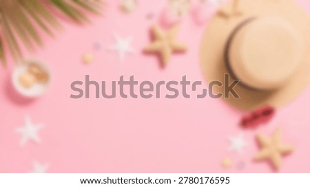 A vibrant, summery flat lay featuring a beach hat, seashells, and tropical elements arranged on a pink background, perfect for vacation themes.