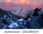 Vibrant Sunset Skies over San Gabriel Mountains via Mt San Antonio summit, A.K.A. Mount Baldy or Old Baldy. Los Angeles and San Bernardino Counties, California, USA.