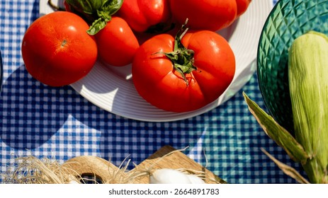 Vibrant tomatoes and corn bask under sunlit picnic cloth, evoking midsummers bounty and Lammas festivals rustic allure