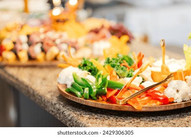 Vibrant vegetable platter with a selection of dips, perfect for healthy snacking.