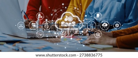 A vibrant workspace showcasing collaboration with SaaS concepts, highlighting modern cloud technology, teamwork, and dynamic business engagements in a professional setting. Trope