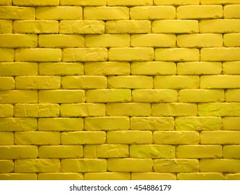 Vibrant Yellow Brick Wall Background