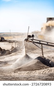 Vibrating screen stone crusher in operation. Crushing stones in a quarry for processing minerals, cement, limestone. Heavy and mobile equipment in a quarry for processing stone into building material.