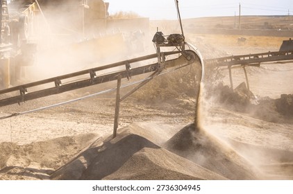 Vibrating screen stone crusher in operation. Crushing stones in a quarry for processing minerals, cement, limestone. Heavy and mobile equipment in a quarry for processing stone into building material.
