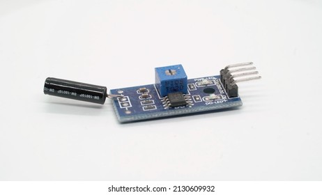 Vibration sensor electronic component module. Small single board computer, device for study at white isolated. Electronics diy robotics chip microcontroller board.