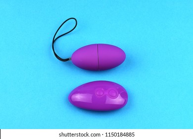 Vibrator Egg Sex Toy For Adult Design Minimal Dildo Vibrator For Clitoris Isolated On Blue Vibrator Egg Sex Toy For Adult Design Minimal Dildo Vibrator For Clitoris Isolated On Blue