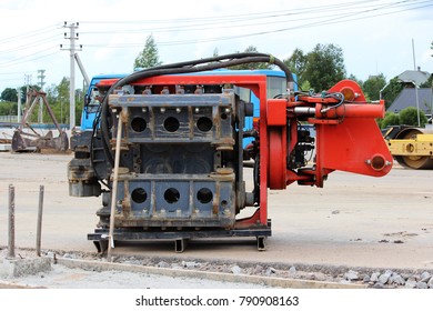 Vibrator pile driving Machine or vibro hammer stands on the site of construction of a major road junction. Russia.