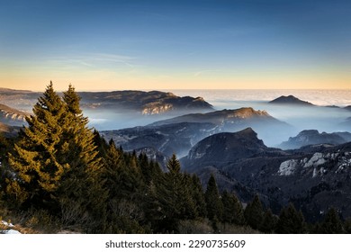 Vicenza Pre-Alps. From left to right: the Tonezza del Cimone plateau, Mount Tormeno and the slopes of Mount Toraro. Arsiero, Veneto, Italy.