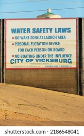 Vicksburg, MS, USA - August 3, 2022: Water Safety Sign On Levee Wall Near The Vicksburg Riverfront Boat Ramp.