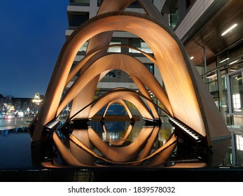 Victoria BC, Canada - December 30, 2019. Street Art Piece With Water Feature In Front Of The Office Building In Downtown Of Victoria BC, Lit Up During Early Evening