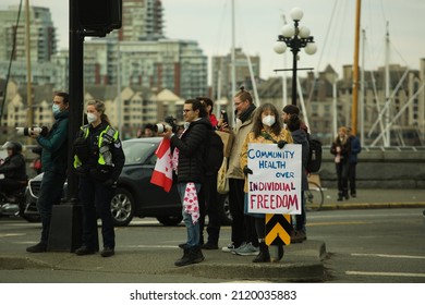 Victoria, BC, Canada - February 5th, 2022:  Counter Protestor At A Rally In Support Of The Ottawa Truckers Convoy Holds A Sign Reading 