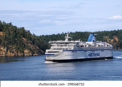 VICTORIA, BC - JULY 2015:  Large multi-level ferries carry cars, trucks, and passengers hourly between Vancouver and Victoria as seen near Victoria in July 2015.