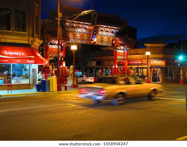 Victoria, BC/Canada - 10/20/2014: street view of\
Chinatown in downtown Victoria at night. Gate of Chinatown in\
Victoria, British Columbia is the oldest Chinatown in Canada. North\
America.