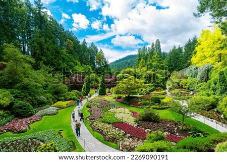 Victoria, British Columbia, Canada - Tourists at Butchart Gardens Sunken Garden