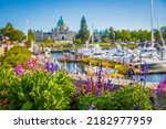 Victoria, British Columbia, Canada-blurred photo. Victoria Harbour and Parliament Buildings at sunny summer day. Inner Harbour, Popular tourist destination with eco-tours, unique shops-July 19,2022