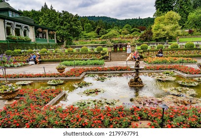 Victoria, Canada - 7-11-2022: People Enjoying The Italian Garden In A Botanical Garden Near Victoria BC, Canada