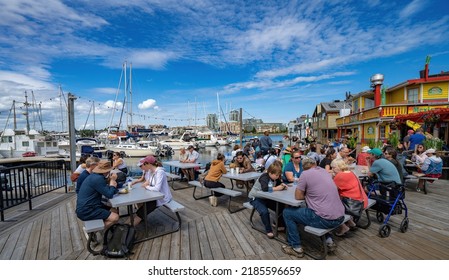 Victoria, Canada - 7-9-2022: Outdoor Dining With Food From Several Restaurants On Fisherman's Wharf