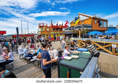 Victoria, Canada - 7-9-2022: Outdoor Dining With Food From Several Restaurants On Fisherman's Wharf