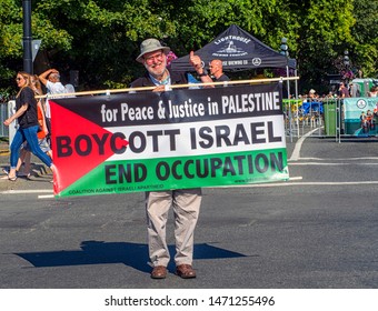 VICTORIA, CANADA- AUGUST 4, 2019: Man Stands In Downtown Victoria Protesting-holding A Sign For Peace And Justice For Palestine, Boycott Israel And End Occupation