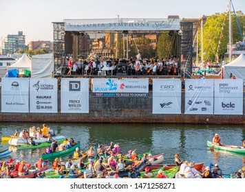 VICTORIA, CANADA- AUGUST 4, 2019: The Symphony Splash Fundraiser Stage In Downtown Victoria On The Barge With People Watching From Their Boats. 