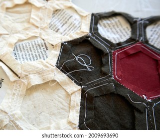 Victoria, Canada - July 1, 2021: The Back Of An English Paper Piecing Method Of Hexagon Quilting With Magazine Templates Still In Place