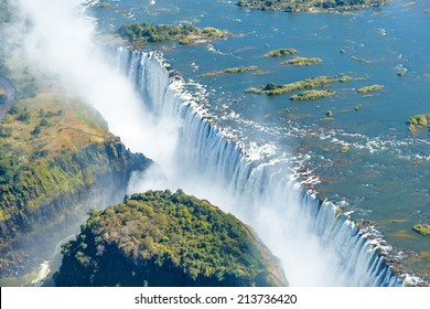 The Victoria falls is the largest curtain of water in the world (1708 m wide). The falls and the surrounding area is the National Parks and World Heritage Site (helicopter view) - Zambia, Zimbabwe