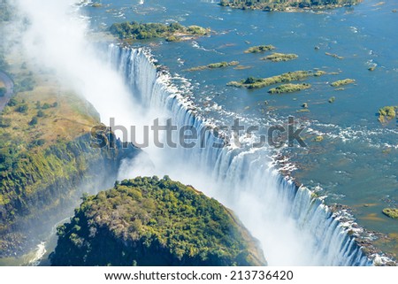 The Victoria falls is the largest curtain of water in the world (1708 m wide). The falls and the surrounding area is the National Parks and World Heritage Site (helicopter view) - Zambia, Zimbabwe Сток-фото © 