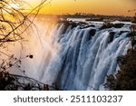 Victoria Falls, one of the Seven Natural Wonders of the World, is a breathtaking sight located on the border between Zambia and Zimbabwe. 