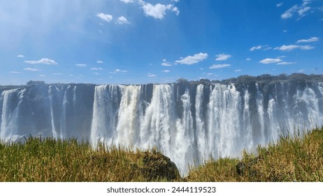 The Victoria Falls is the waterfall located on the Zambezi River between and Zimbabwe. - Powered by Shutterstock