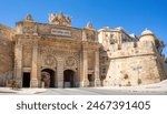 Victoria gate and city fortification. Beautiful view of entrance of ancient city Valletta, Malta. The capital of the Republic of Malta. Cultural heritage of Malta