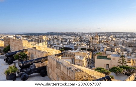VICTORIA, GOZO, MALTA - January 11, 2022 - Fortified buildings and the old moat within the citadel with views towards the city and Church, Victoria, Gozo, Malta, Europe, January 11, 2022.