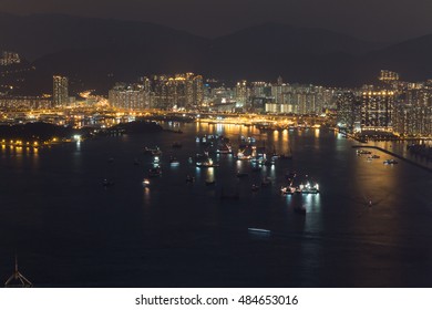 Victoria Harbour And Stonecutters Island At Night