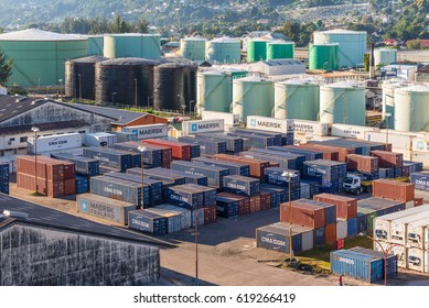 Victoria, Mahe Island, Seychelles - December 17, 2015: Fuel storage and cargo containers stacked in shipping yard for transportation import, export, logistic industrial at Victoria, Mahe, Seychelles.
