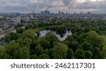 Victoria park London aerial view of lake and city of London skyline 