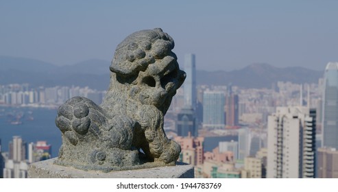 Victoria Peak, Hong Kong 05 February 2021: Hong Kong Skyline With Lion Statue