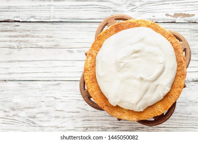 Victoria Sponge Cake With Whipped Cream Over A White Wooden Rustic Table Top. Image Shot For Above.