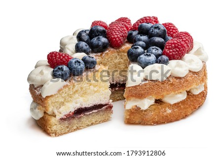 Victoria  sponge cake with whipped cream and berries on top isolated on white 